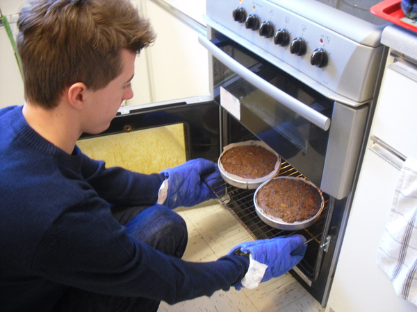 Jonny takes our cakes out ready for decorating